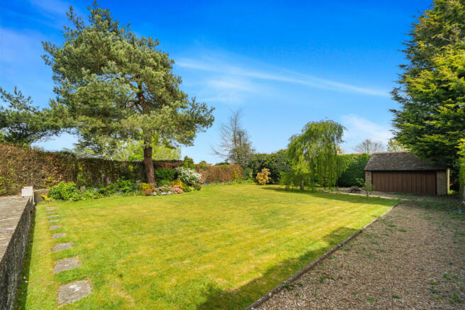 Large private and secluded rear garden with detached garage with power and light