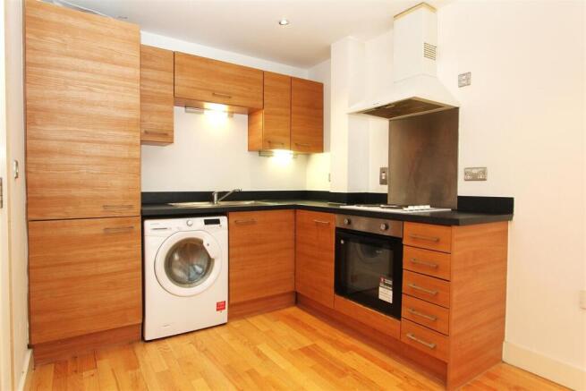 Modern fitted kitchen with integrated appliance...