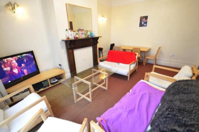 Bright, well-furnished living room with comfort...