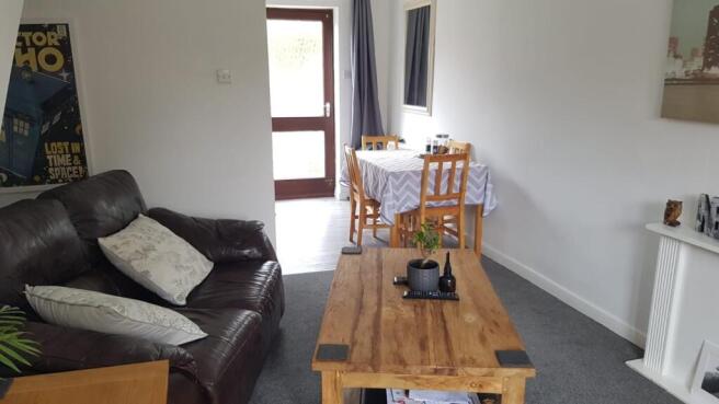 Bright and welcoming living room featuring a co...