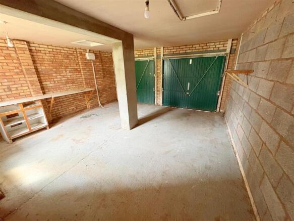 Double garage with up and over door onto rear lane