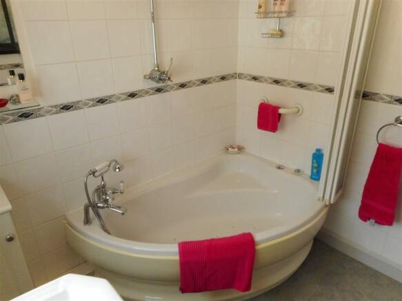 PART TILED FAMILY BATHROOM W/C