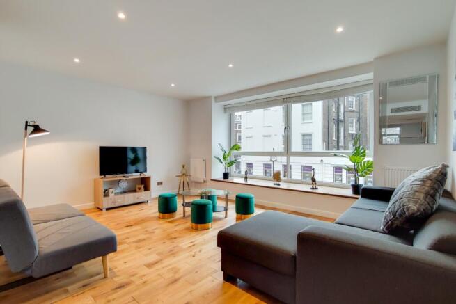 Bright lounge with floor-to-ceiling windows...