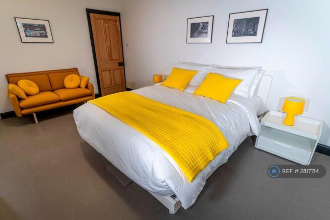 Front Bedroom With Small Sofa