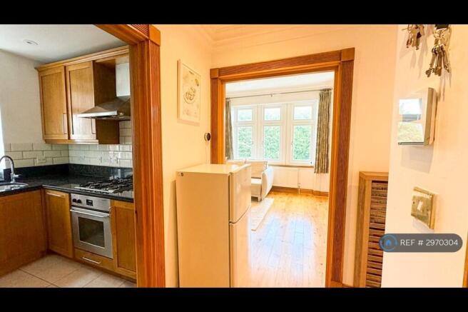 Hallway Leads To Living Room And Kitchen