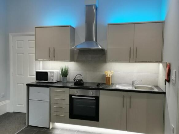 Modern kitchen with sleek LED accent lighting...
