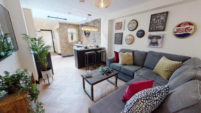 A spacious, well-lit living room with contempor...