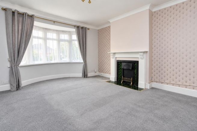 Bright Empty Living Room with Bay Window and Firep