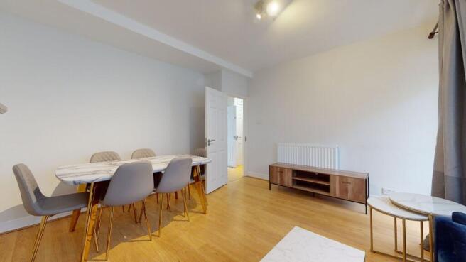 Bright living area with modern dining set...