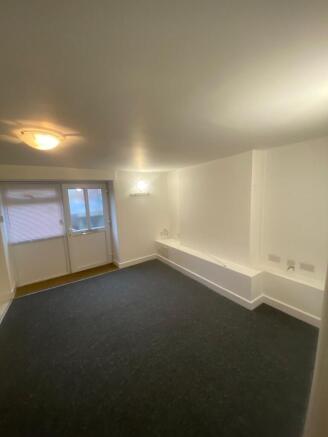 Bright, freshly painted living room with neutra...