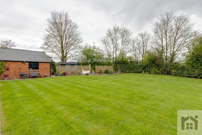 Lawn across to the garage