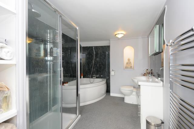 Bathroom with bath and shower