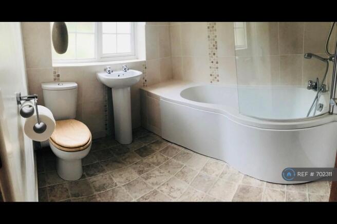 Family Bathroom With Shower Over Bath