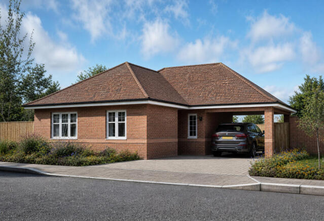 A modern brick bungalow with a car parked in the carport sits on a paved driveway