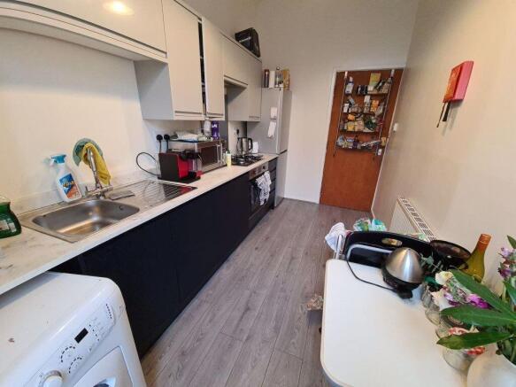 Bright and modern kitchen featuring ample count...