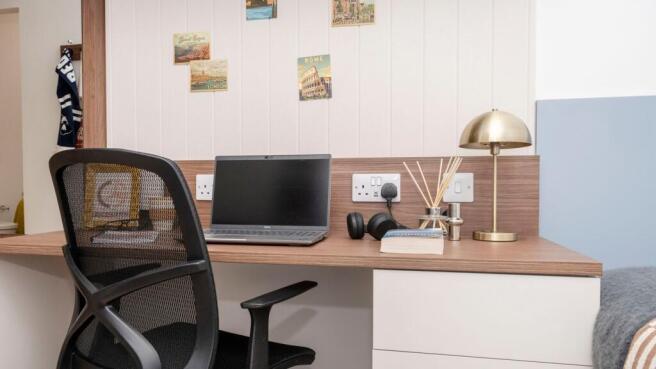 Well-arranged bedroom study area with a wooden ...