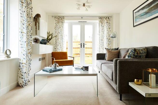 With windows on 3 sides the living room has lots of natural light