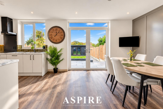 Sunlit Modern Kitchen with Garden Views.png