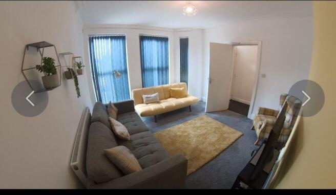 Bright, modern living room with two comfortable...