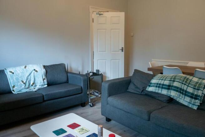 A modern, well-maintained living room featuring...