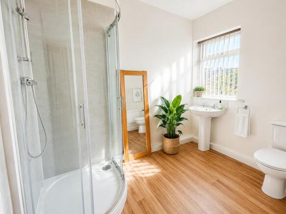 Bright, spacious bathroom with modern shower...