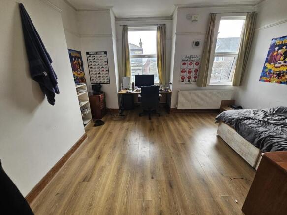 Bright, spacious bedroom with large windows...