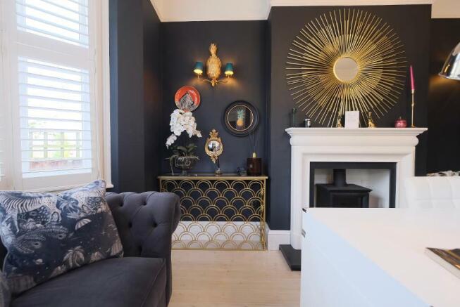 Elegant sitting room with gas log burner