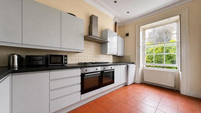 Bright modern kitchen with high ceilings...