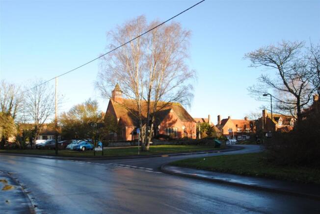 Charlton Village Road with Holy Trinity Church
