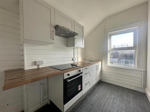Bright fitted kitchen with wooden worktops...