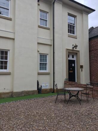 Charming pale-cream front with classic sash win...