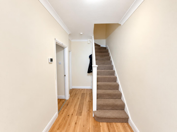 Bright Minimalist Hallway with Staircase.png