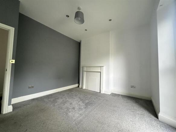 Modern double bedroom with stylish feature wall...
