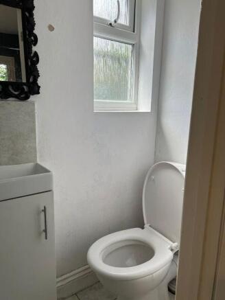 Bright and tidy cloakroom with natural light...