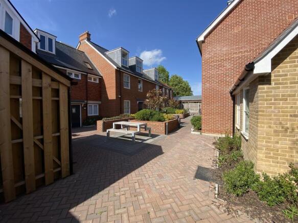 Bright and spacious courtyard with picnic bench...