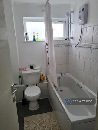 Bright Bathroom With Bath And Shower.