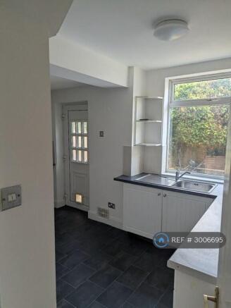 Kitchen With Access To Back Garden And Garage