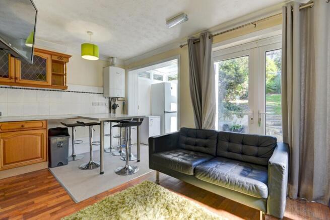 Bright and welcoming living area featuring a st...