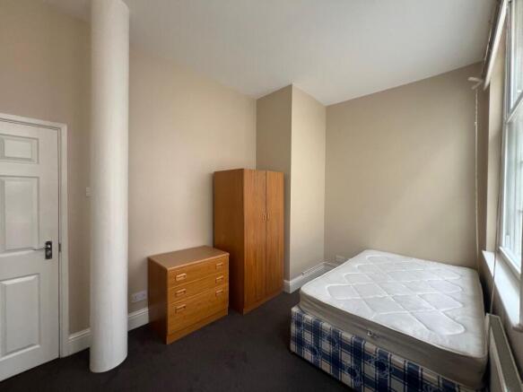 Bright double bedroom with ample storage space...