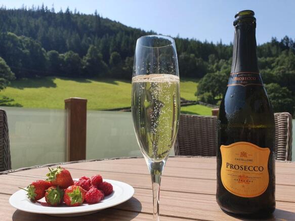 Prosecco And Fresh Berries On The Lodge Decking Ov