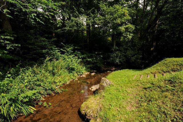 A strem runs along the boundary