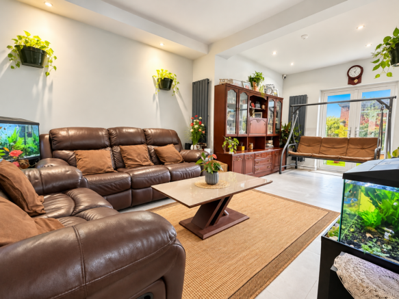 Plant-Filled Leather Sofa Living Room.png