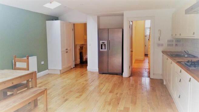 Kitchen with fridge and table.icarus.jpg