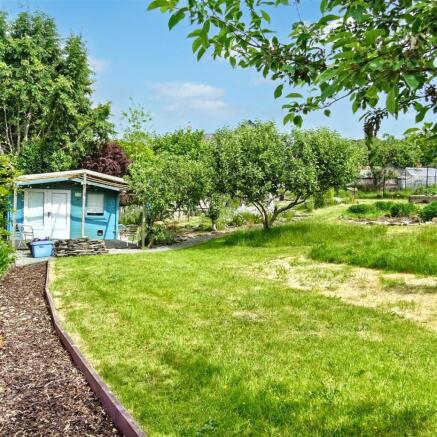 Log Cabin, garden and views up to the house