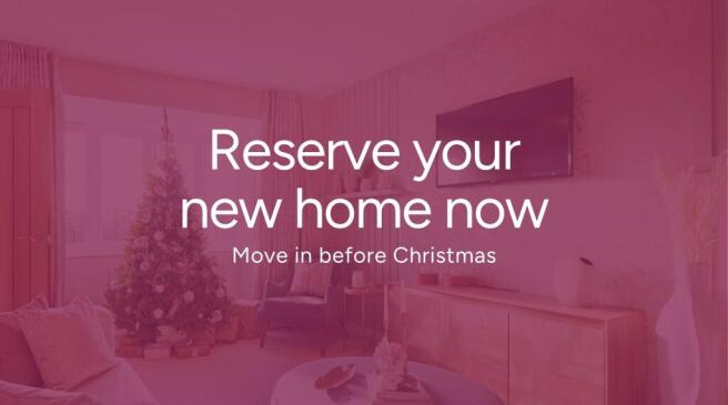A festive living room with a Christmas tree in the foreground and a television and cabinet in the ba