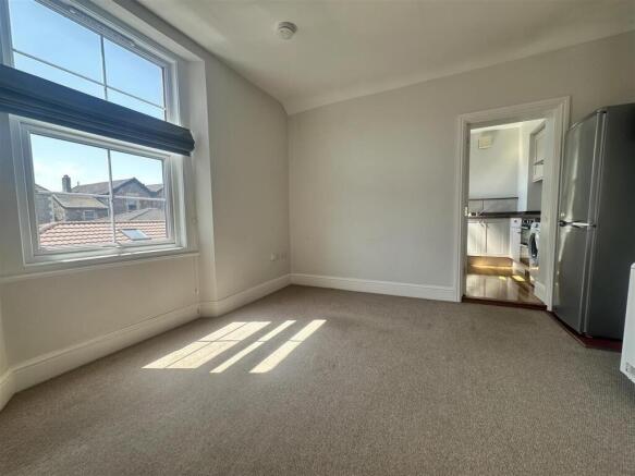 Bright and airy bedroom with large windows...