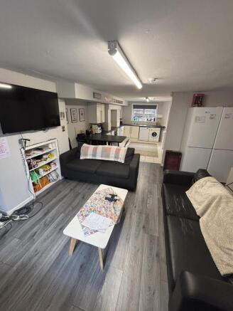 A bright, modern living room featuring comforta...