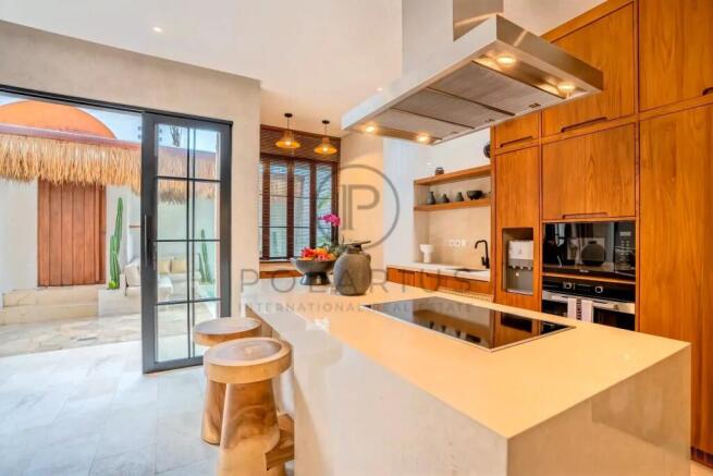 Modern kitchen with a sleek island, wooden cabinet