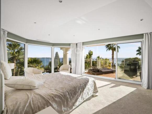 Master suite with large openings to the sea