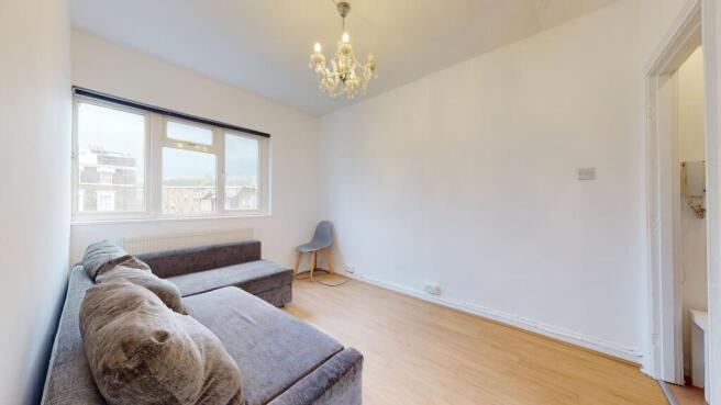 Bright living area with stylish chandelier...